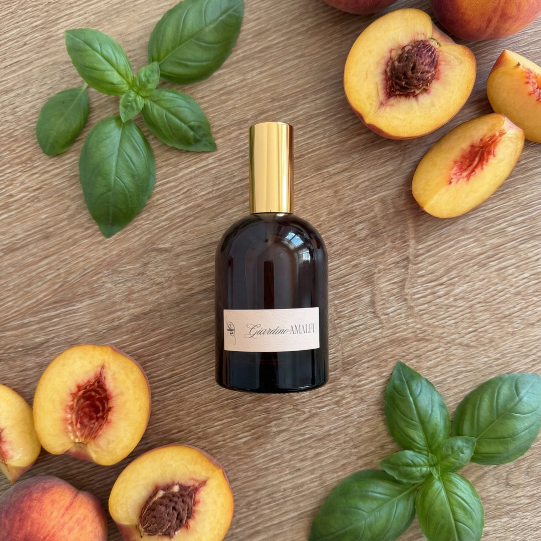 Bottle of Cacciafiume with peaches and basil leaves on a wooden surface